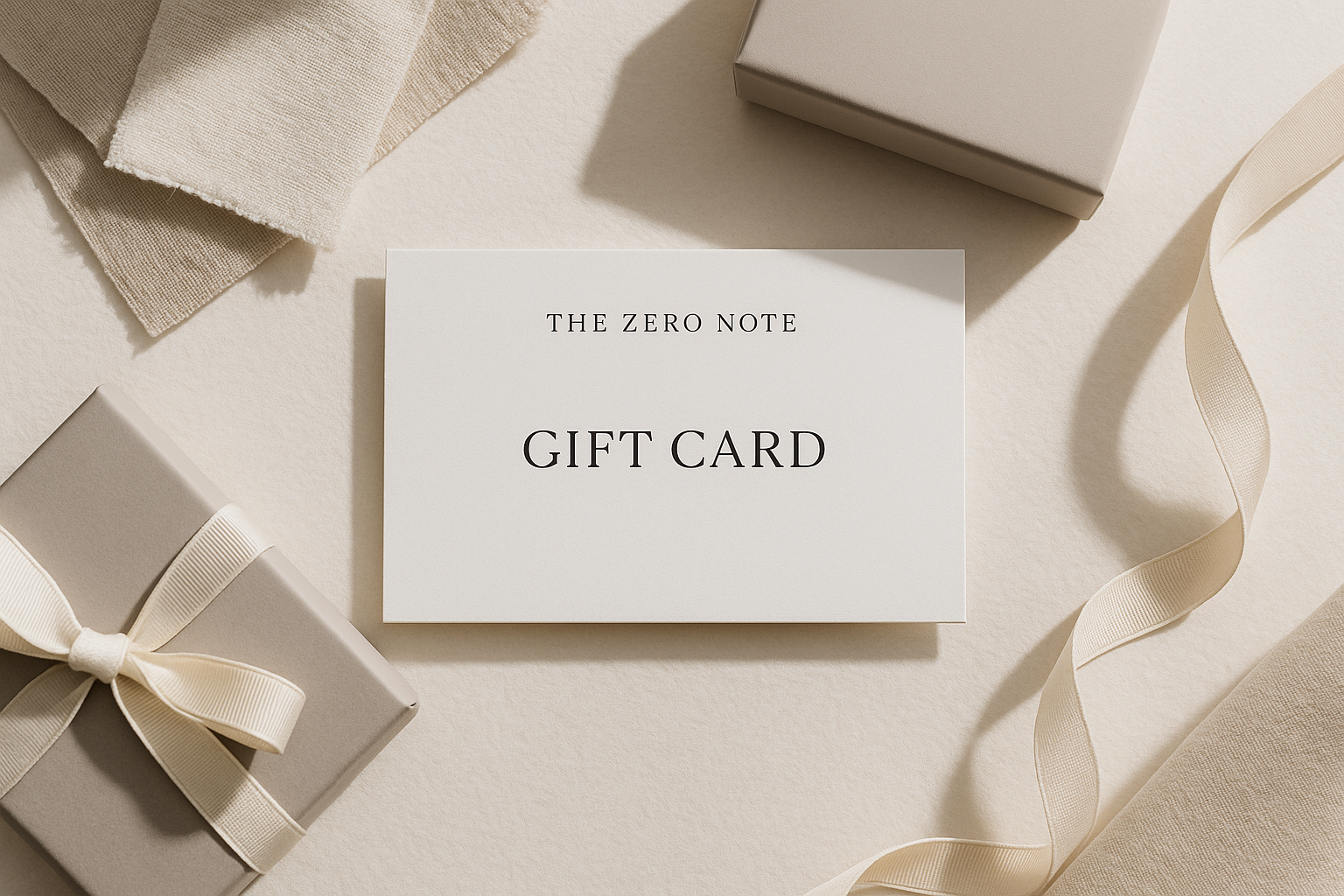 A luxury minimalist flatlay featuring a The Zero Note brand gift card on textured off-white or beige paper, surrounded by soft natural fabric swatches, neutral-toned packaging, and elegant ribbon. Bright natural lighting, soft shadows, and a clean editorial aesthetic. No loud colors, only neutral tones (white, beige, soft gray, muted black). Ultra high resolution, photography style, minimal branding.
